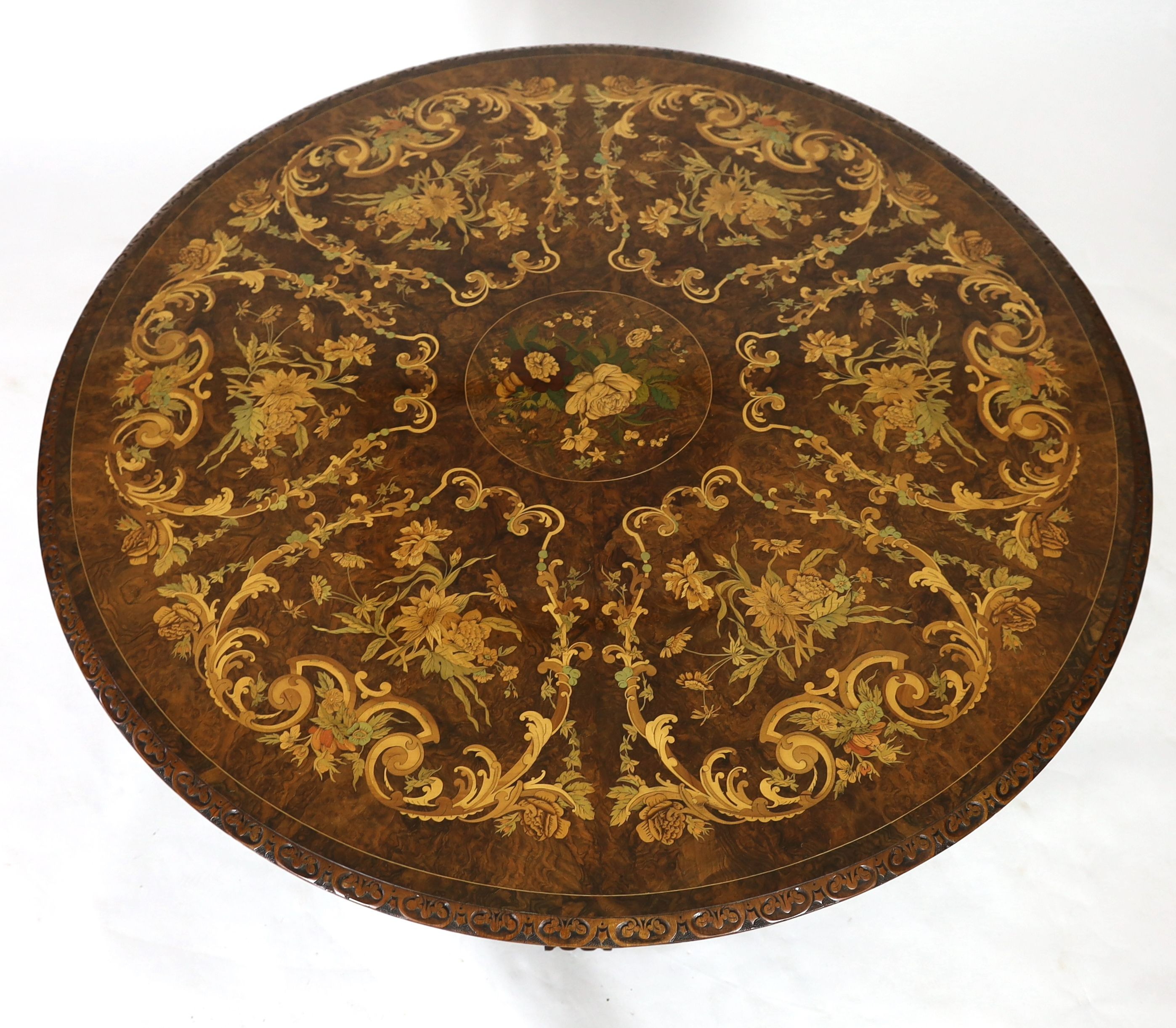 A Victorian walnut and marquetry breakfast table, diameter 144cm H.77cm